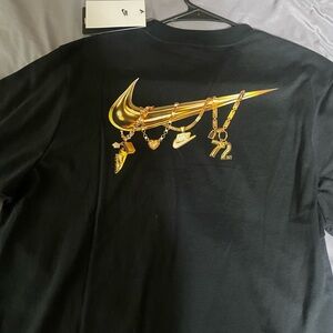 Nike Black Tee with Gold Charm Swoosh